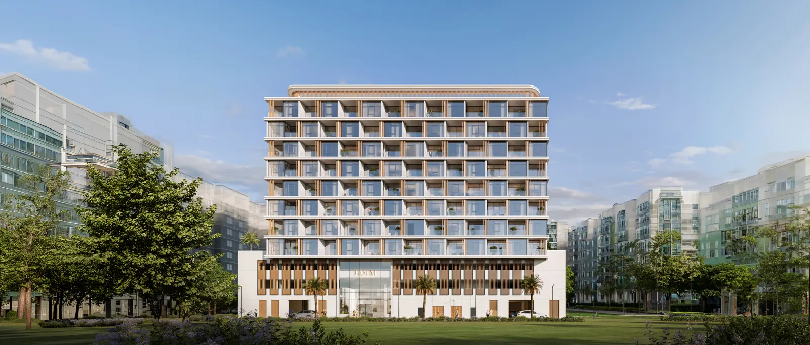 Full front facade seen across a green lawn