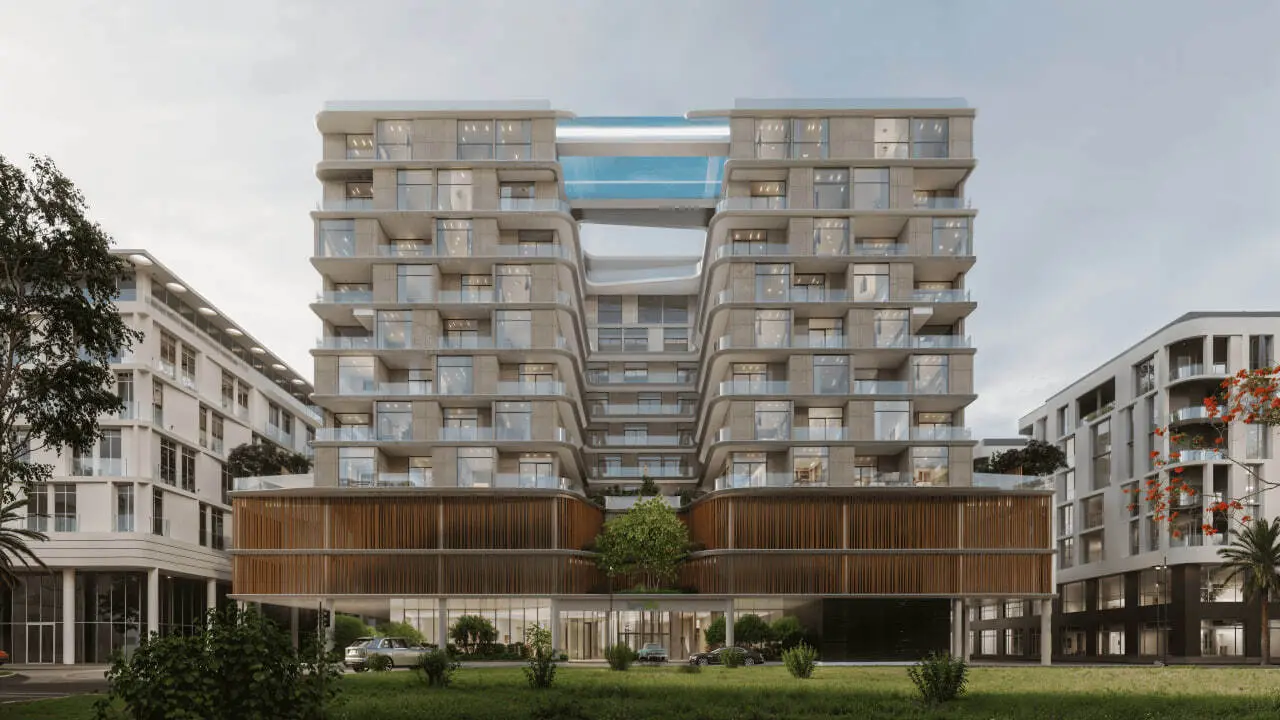 Front view of the building with a sky pool bridge