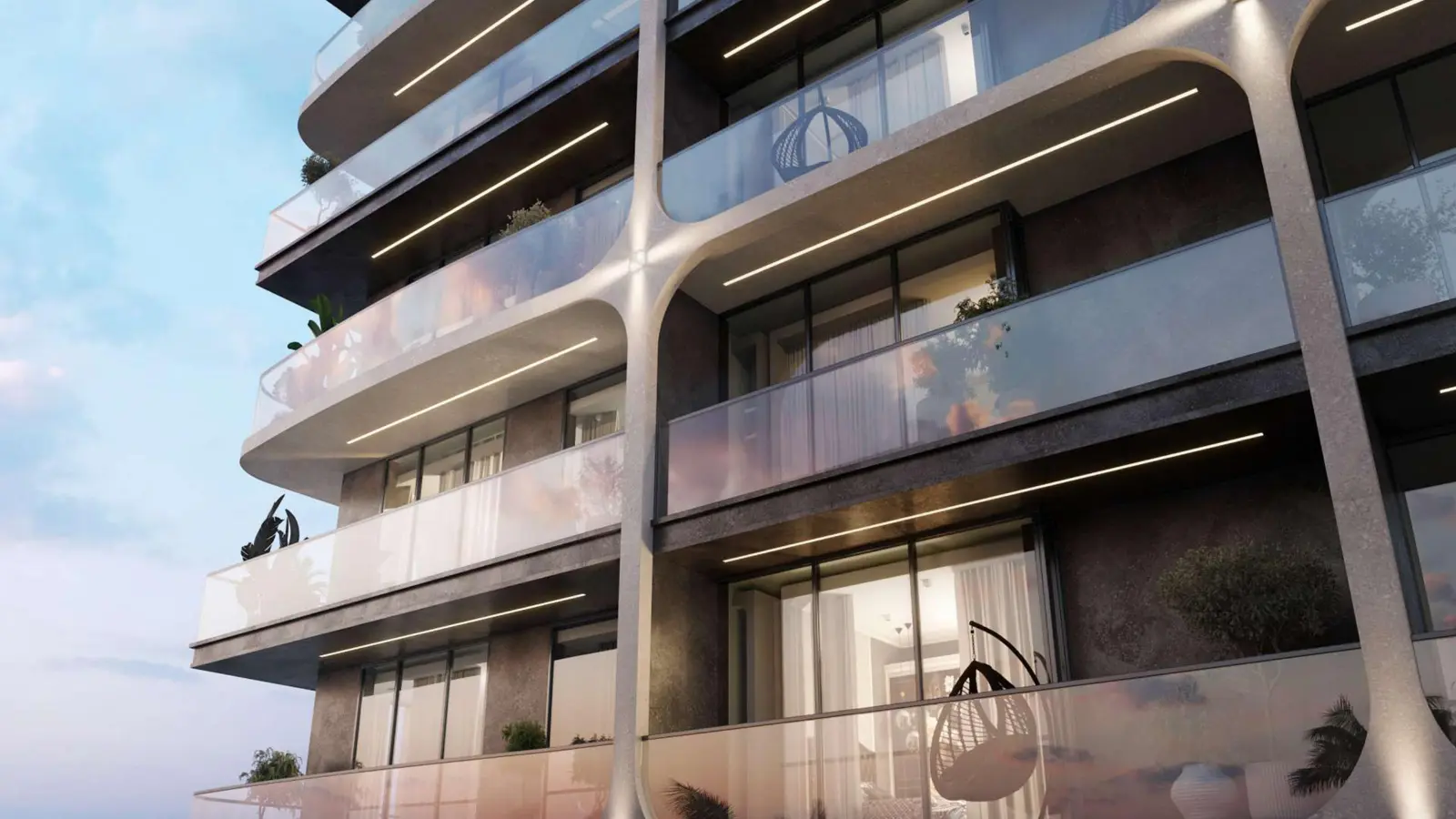 Curved balconies on the facade at dusk