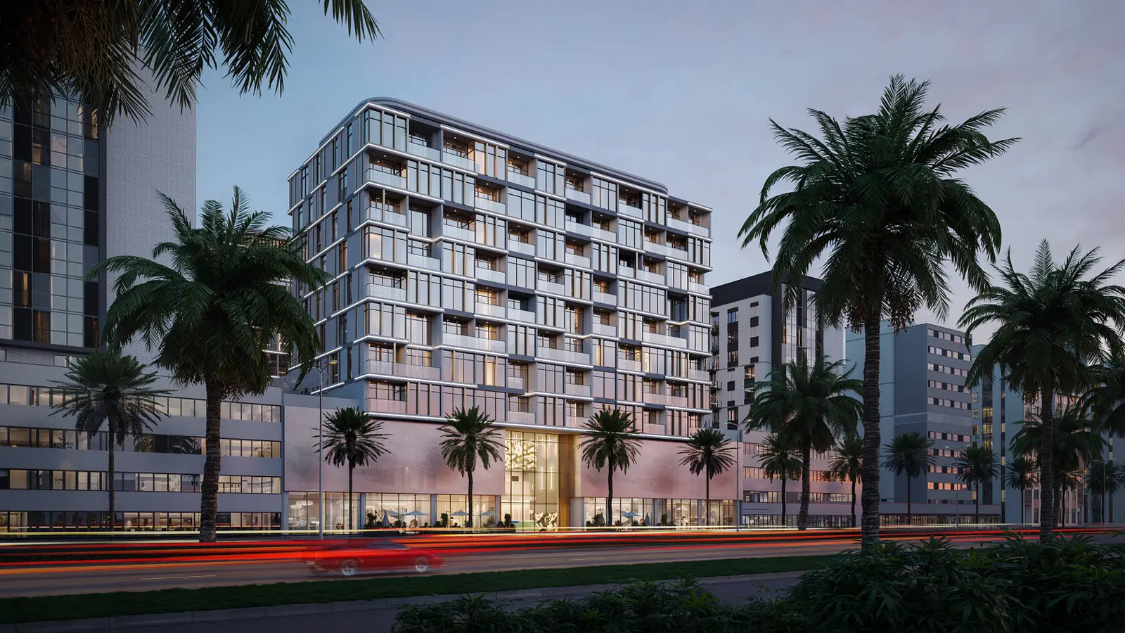 Residential building at dusk with palms