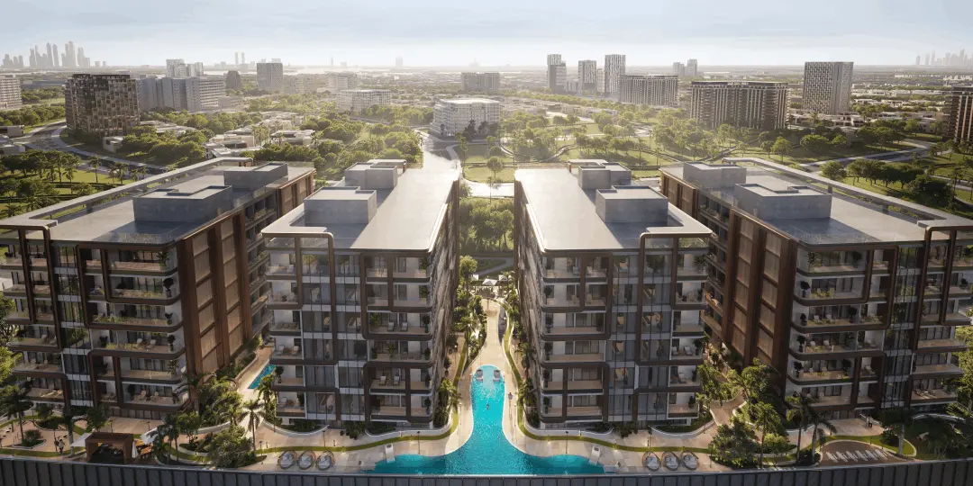 Four buildings around a lagoon pool, aerial view