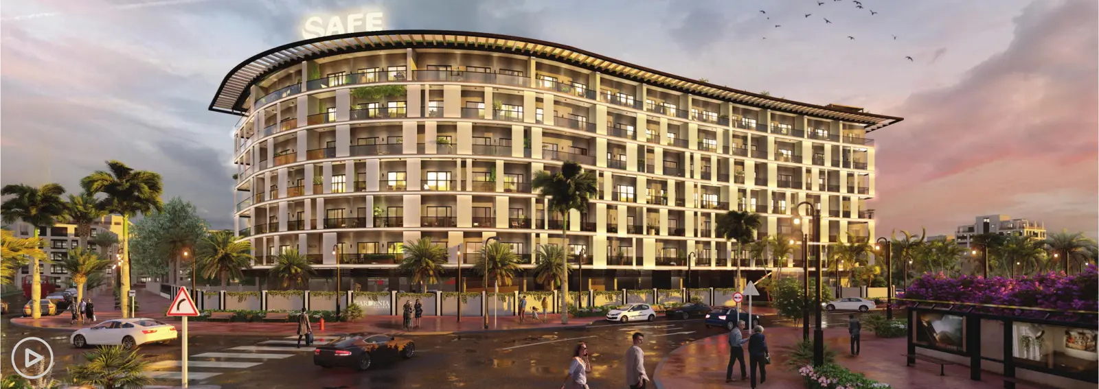 Curved building facade at dusk with street
