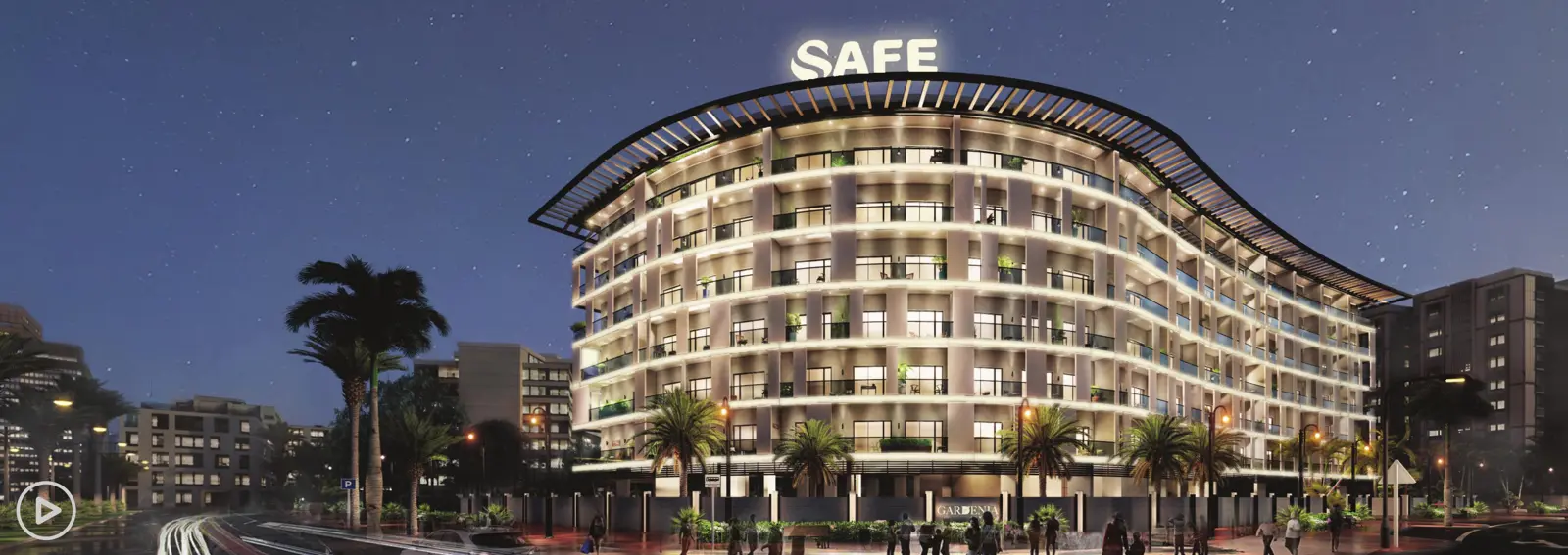 Night view of the curved building with lit facade
