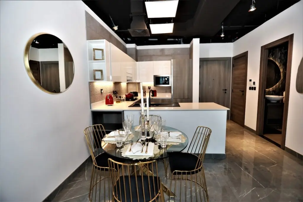 Dining table next to open kitchen