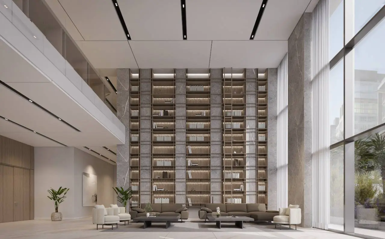 Double-height library lounge with tall bookshelves
