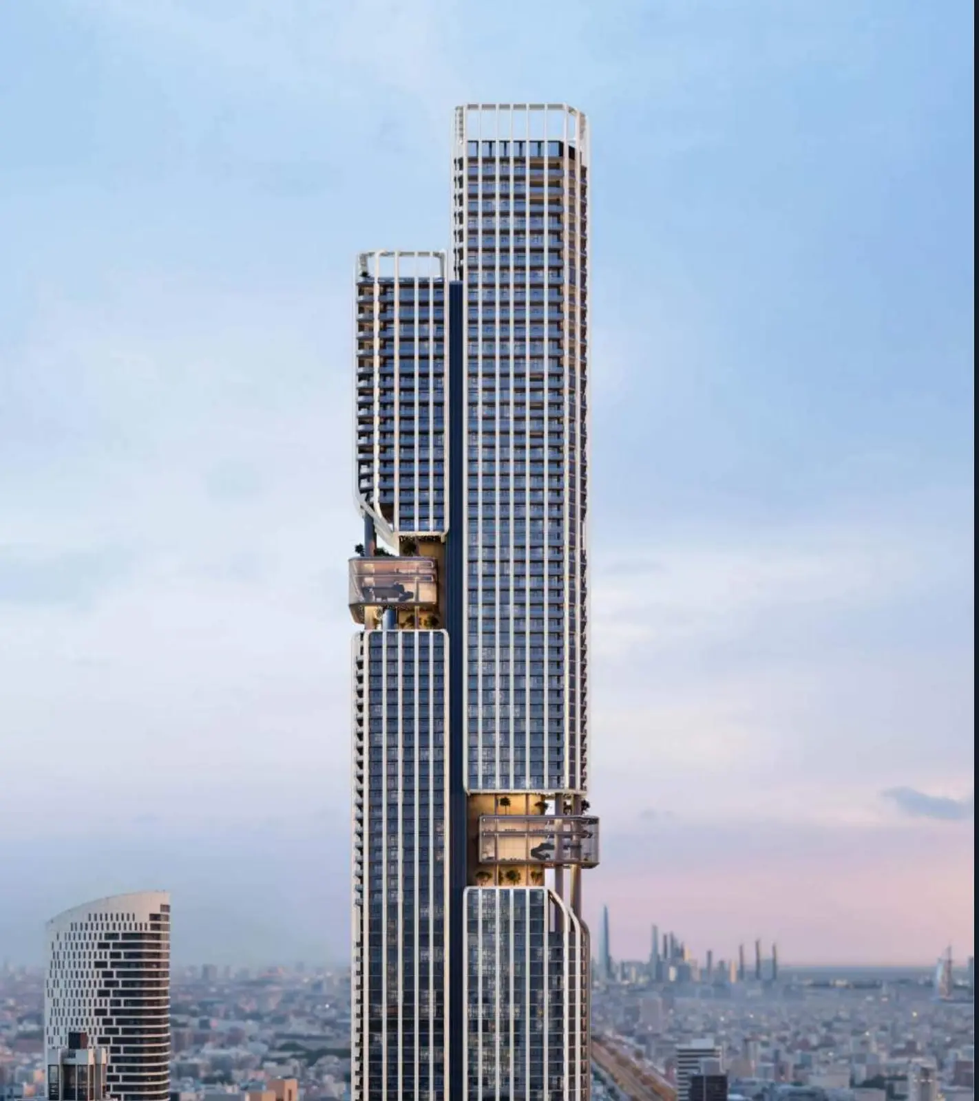 Two-part tower rising above the Dubai skyline