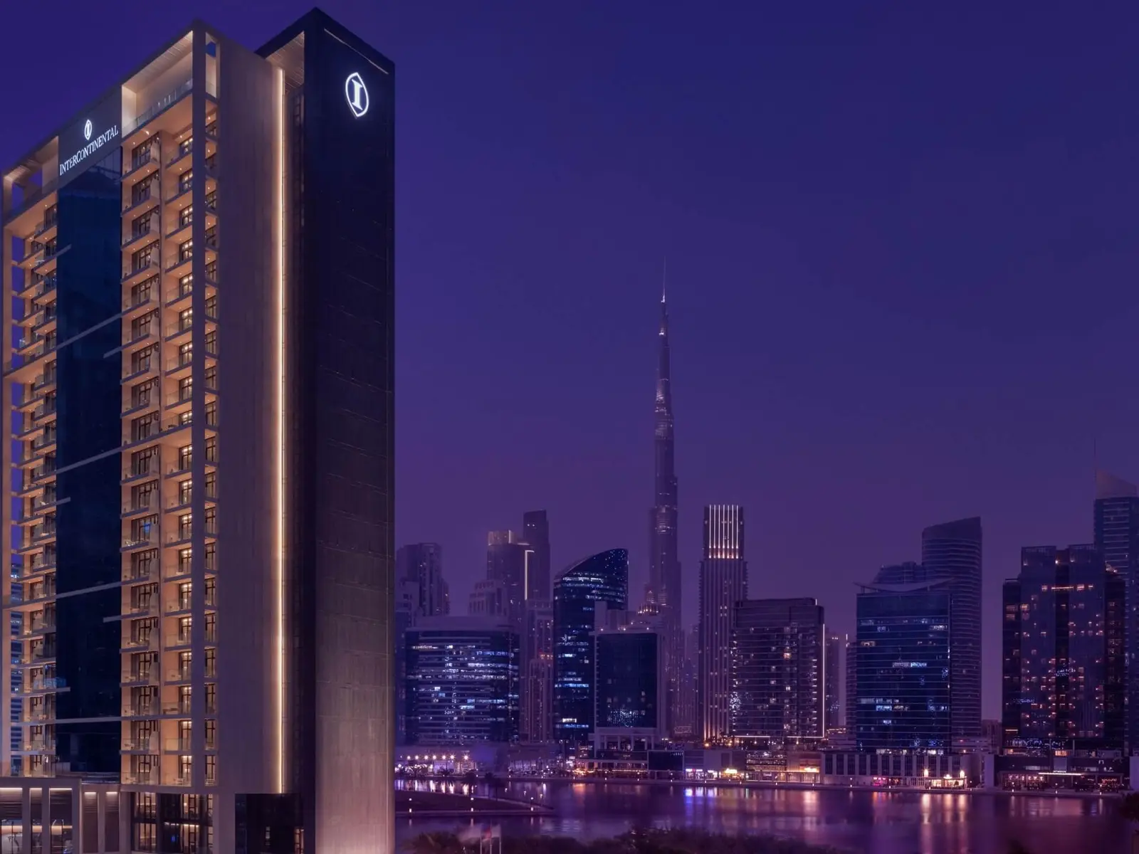 Tower at dusk with Burj Khalifa behind