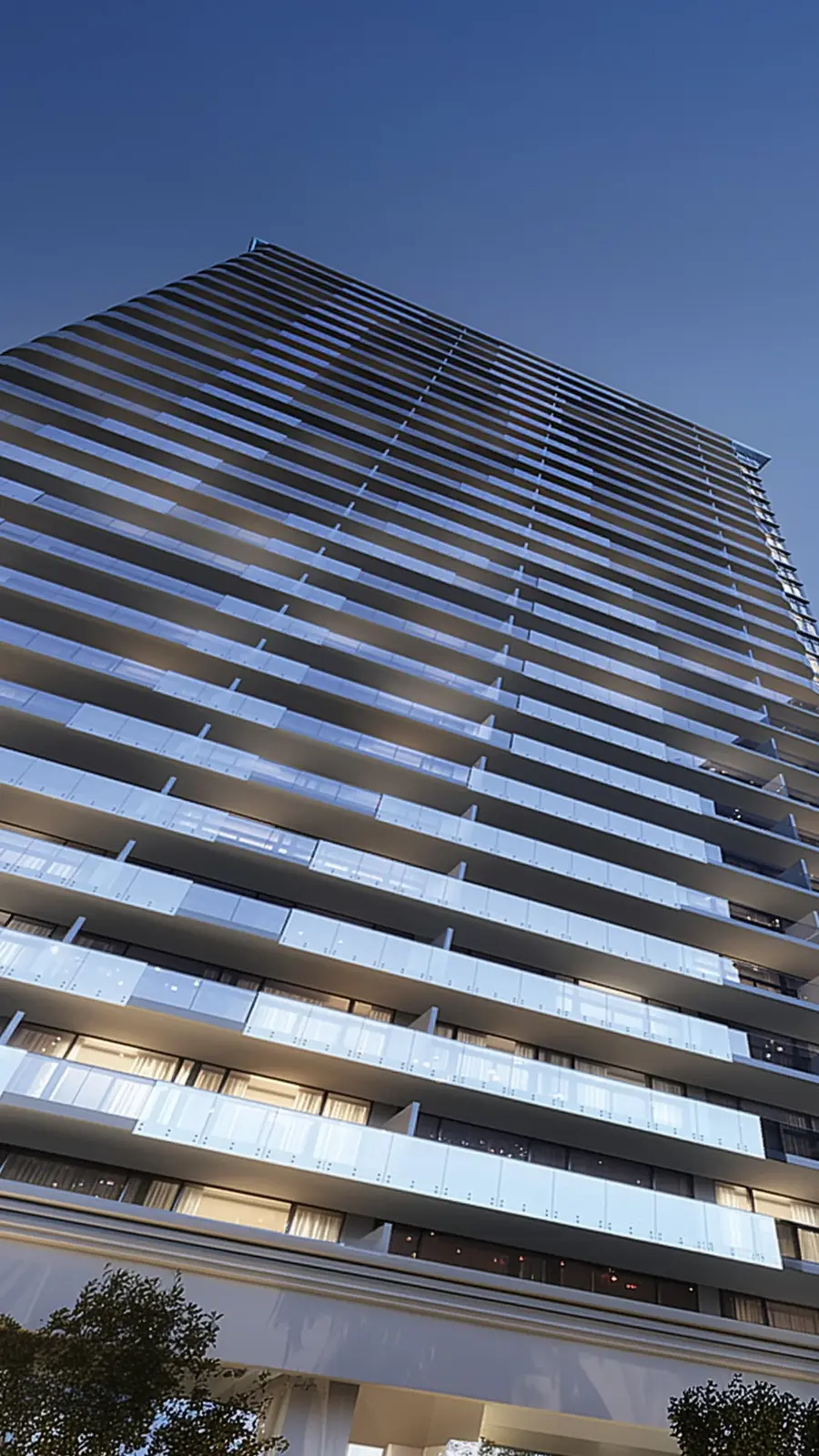 Low-angle view of the tower's glass balconies at dusk