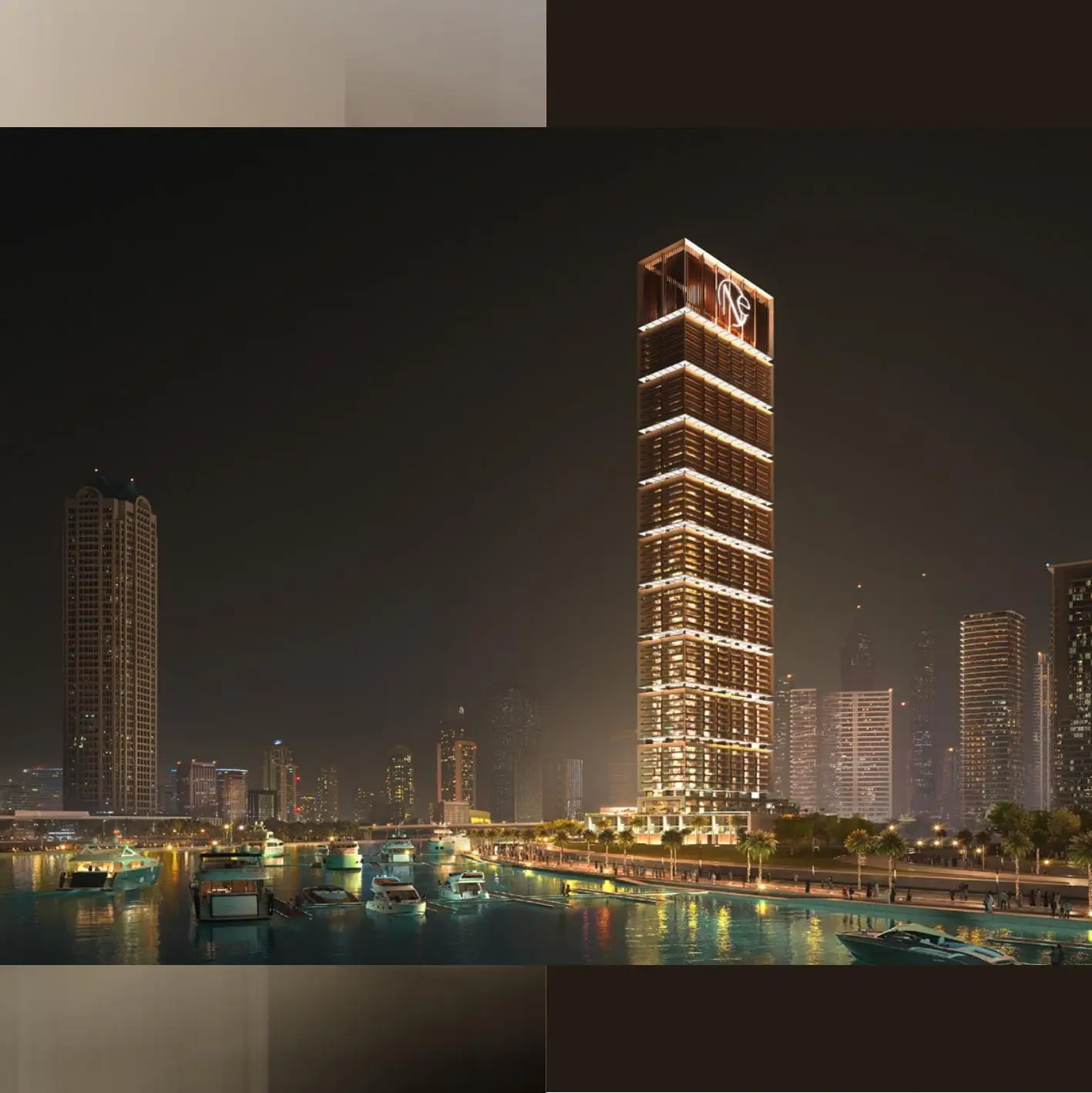Tower lit up at night above the canal