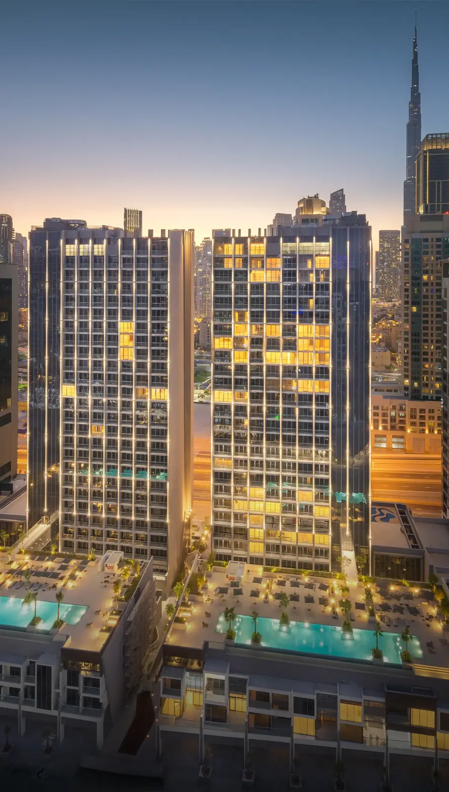 Twin towers and pool decks, Burj Khalifa behind