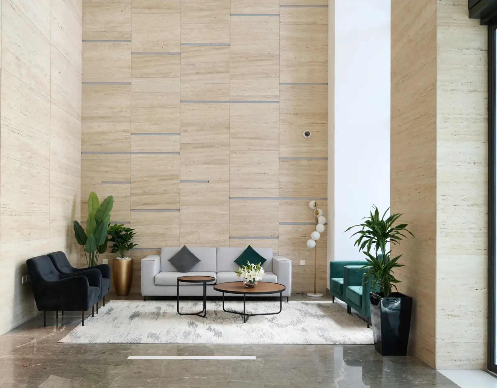 Lobby seating area with stone-clad walls