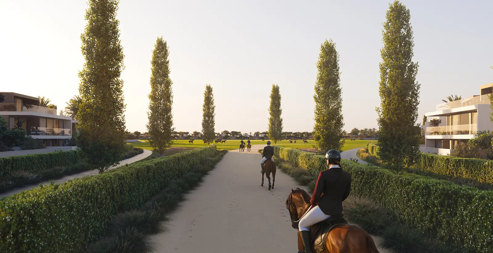 Riders on a path between villas toward polo fields
