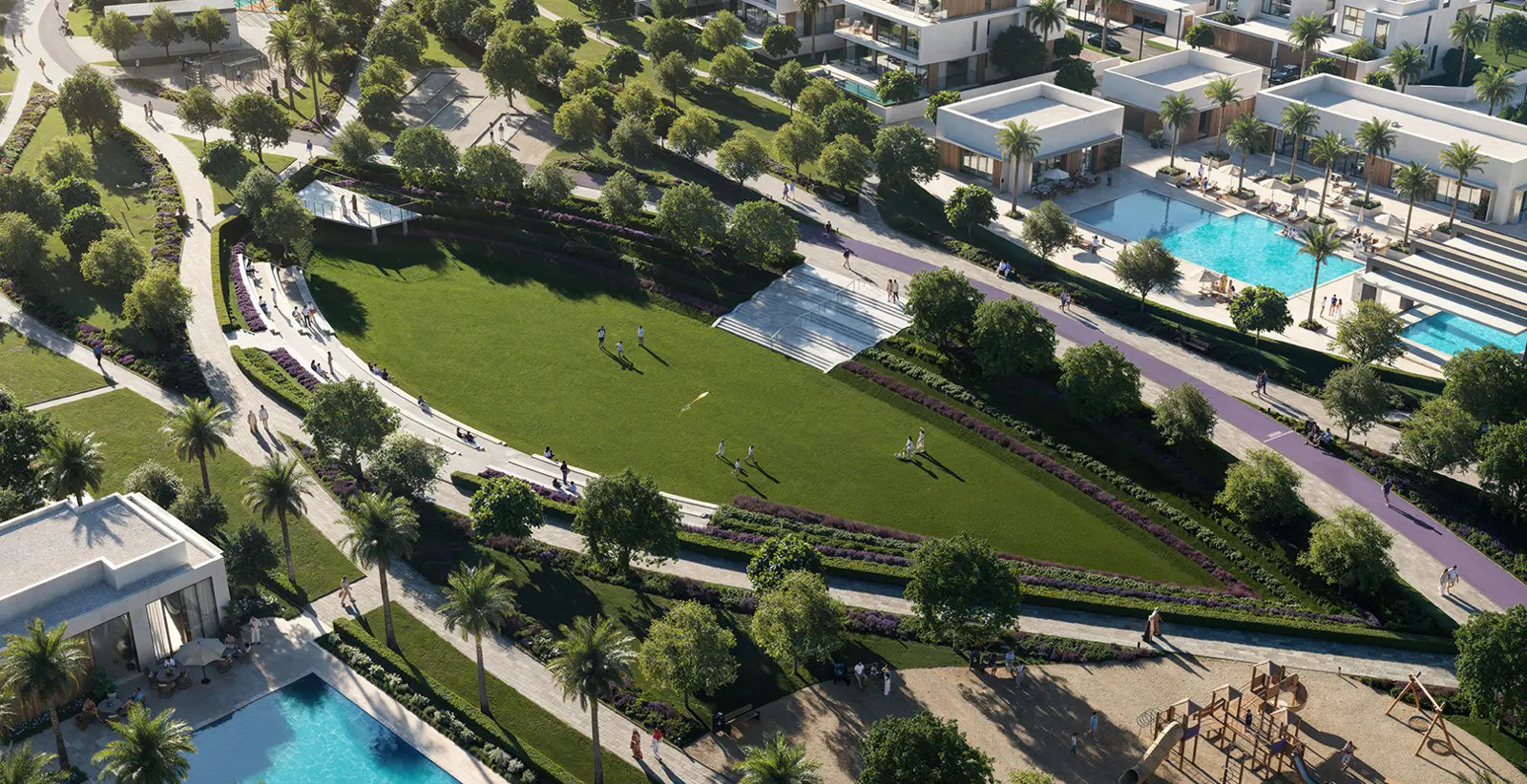 Aerial view of lawn, pools and paths in the community