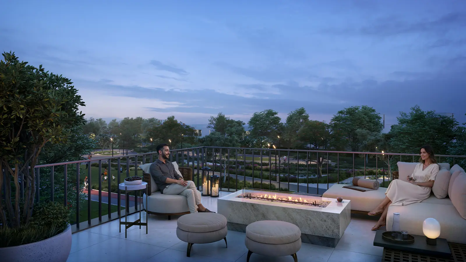 Terrace with fire pit overlooking green landscape at dusk