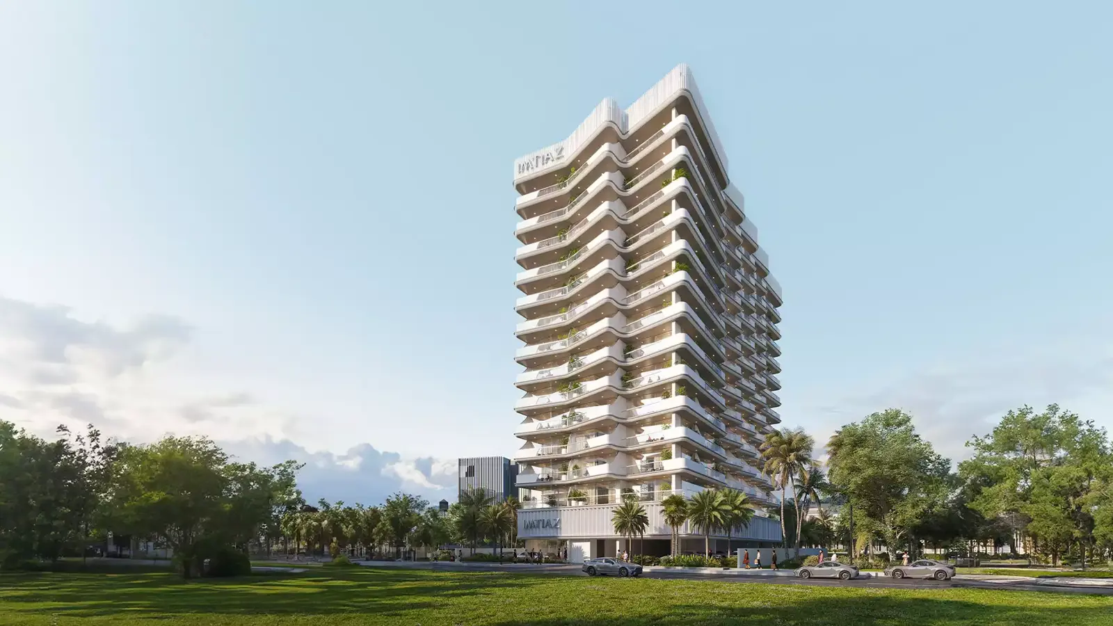 Tall white building with curved balconies and trees
