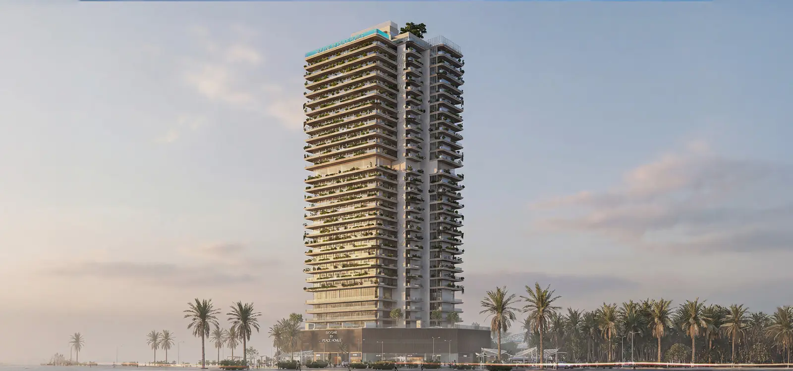 Tower seen from across the water with palm trees