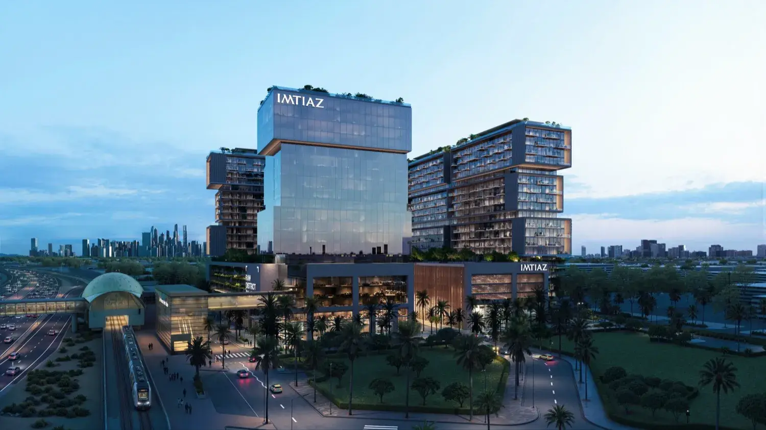 Towers and metro station with city skyline