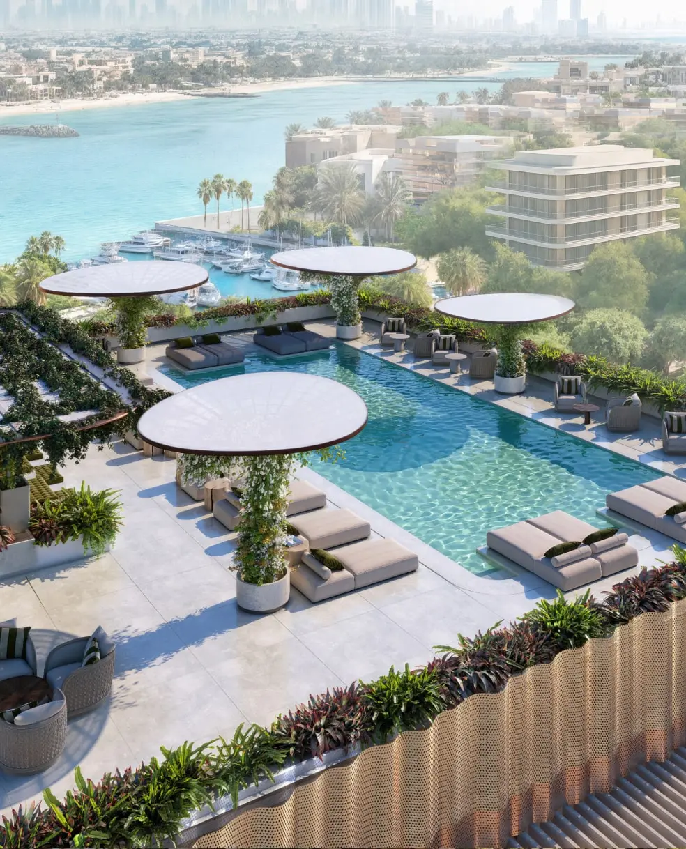 Rooftop pool deck with loungers and sea view