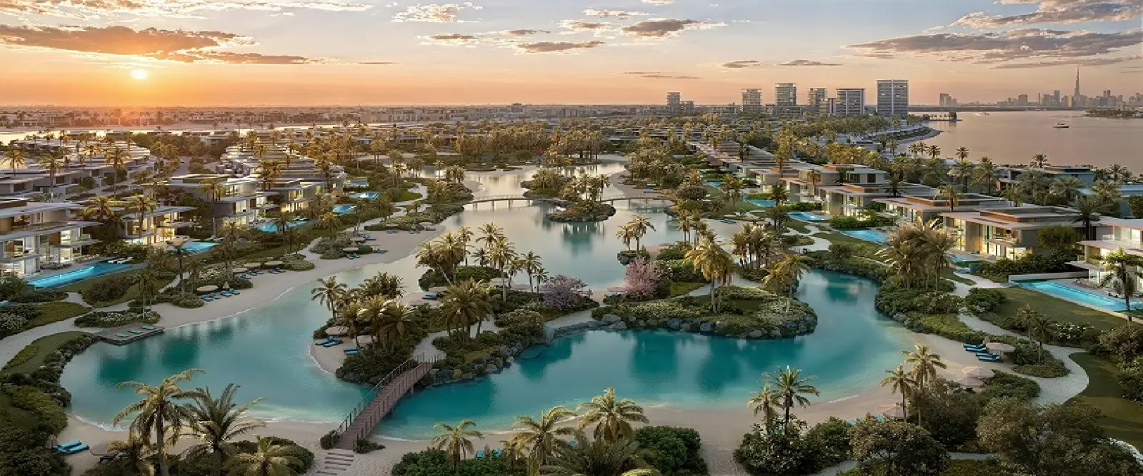 Aerial view of lagoons and villas at sunset