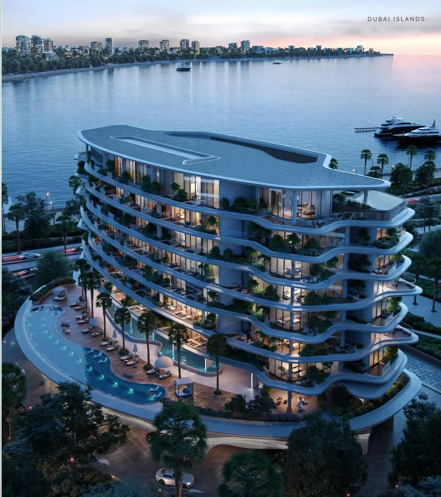 Wave-shaped building at dusk beside the water