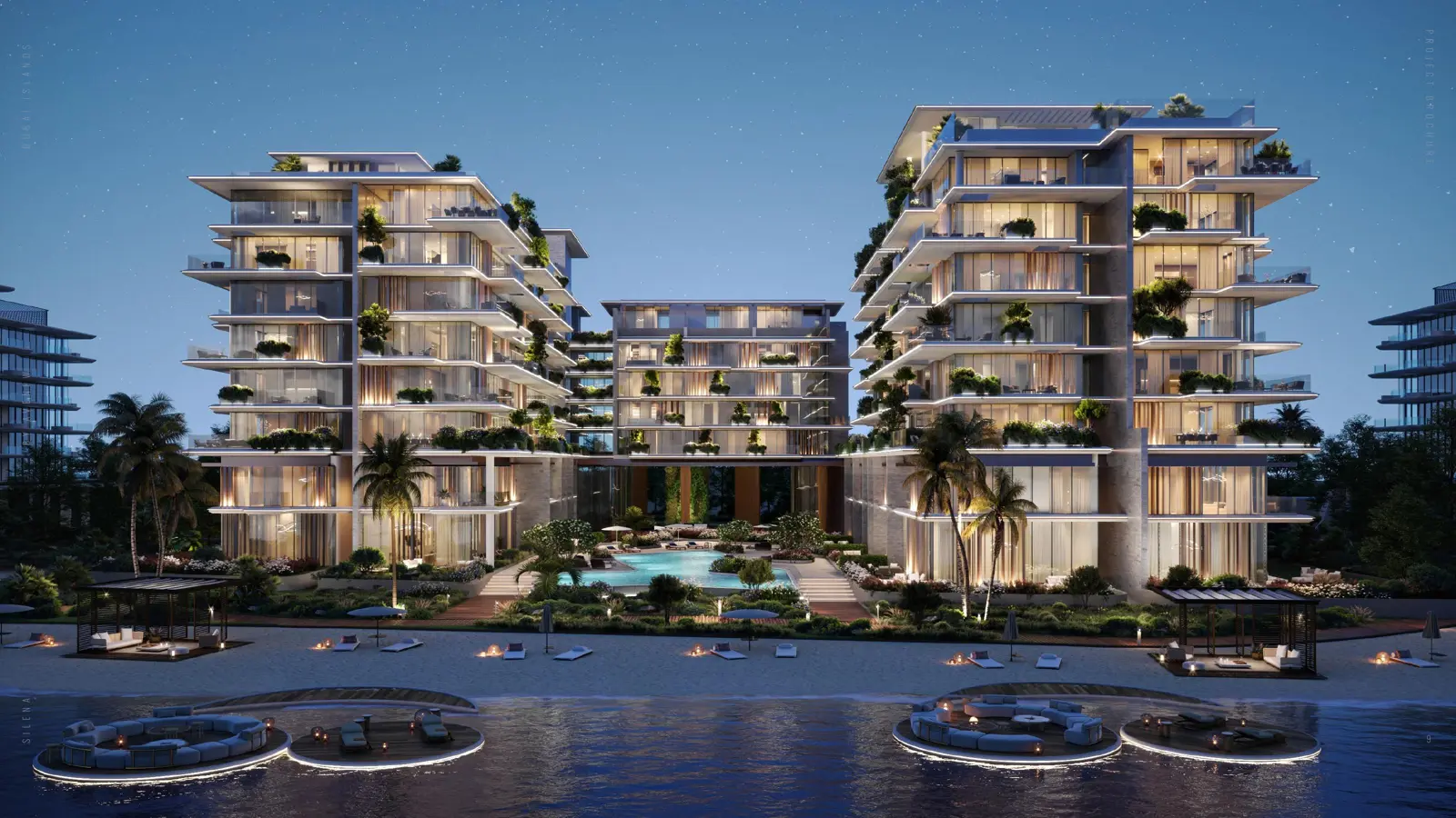Twilight view of the buildings and pool from the sea