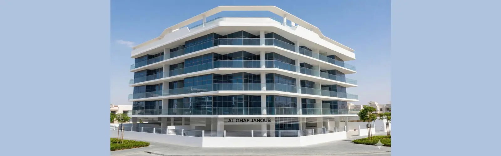 White and glass mid-rise building with the Al Ghaf Janoub sign