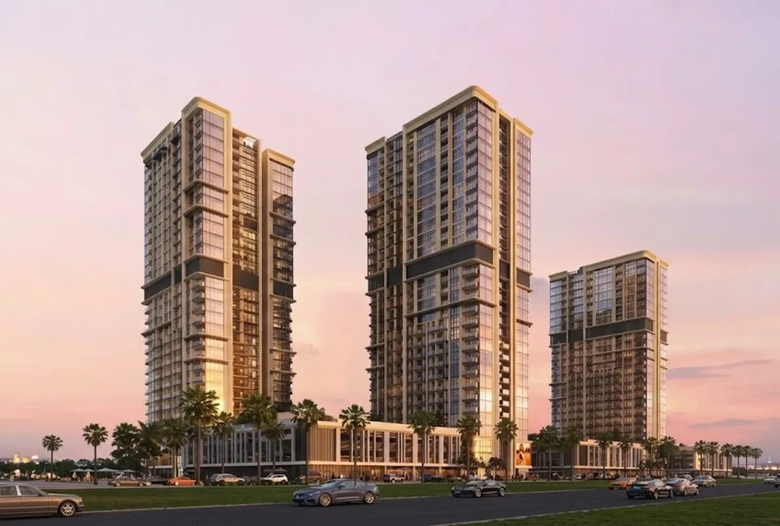 Towers at dusk along a palm-lined road