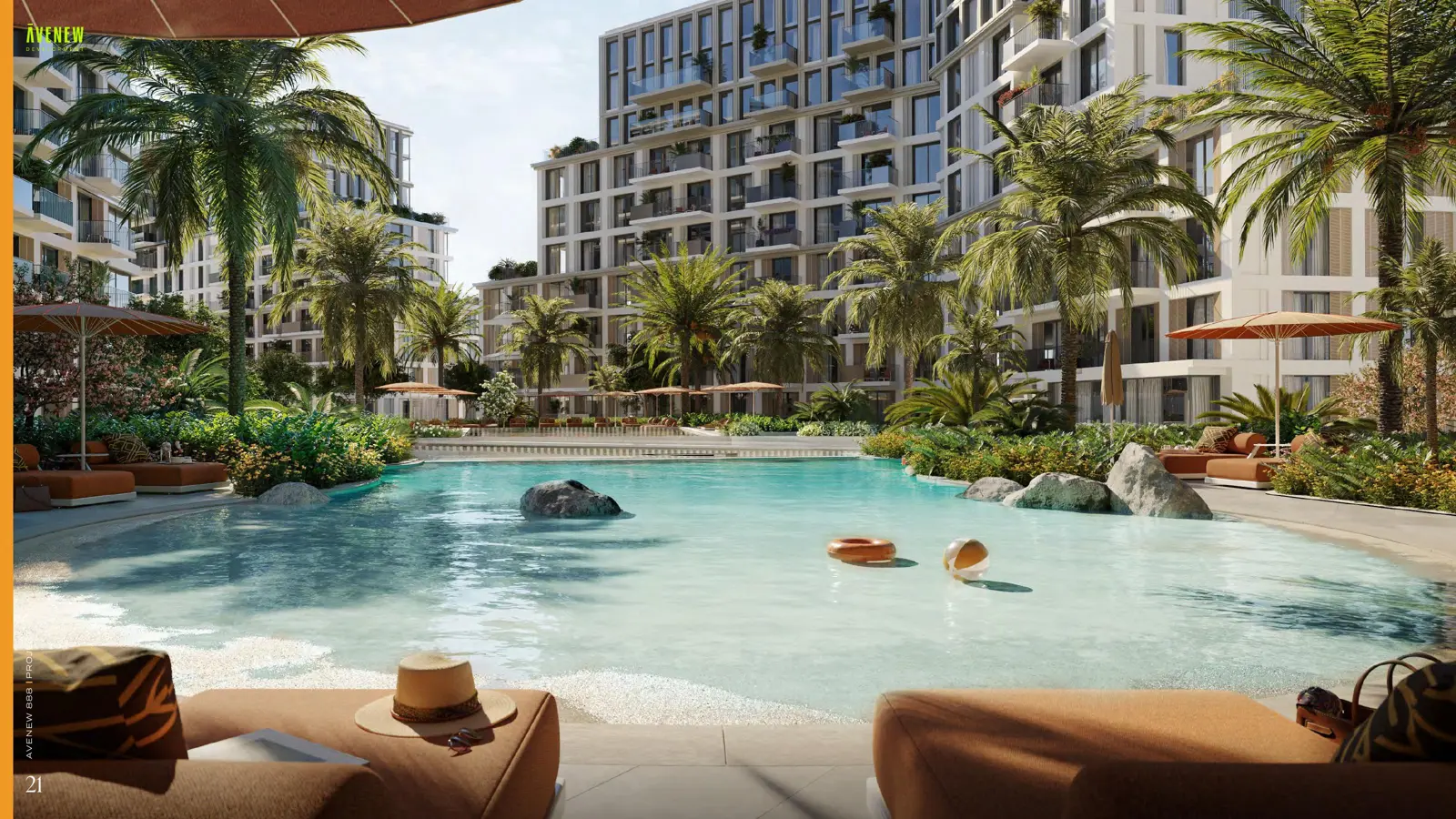 Lagoon-style pool with loungers and buildings behind