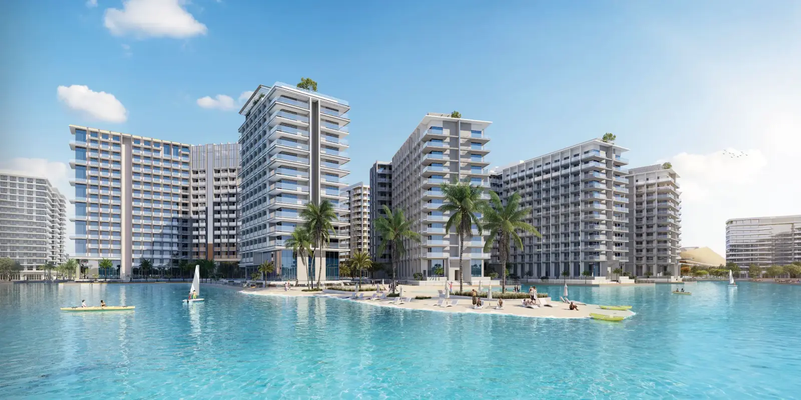 Apartment buildings on the lagoon with a sandy beach