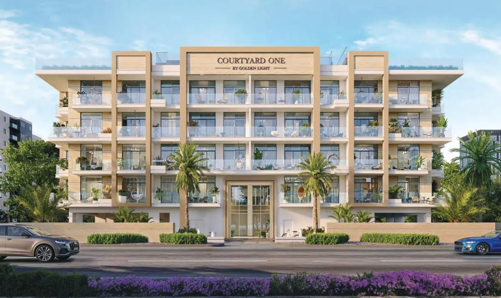 Front facade of Courtyard One with palms and cars