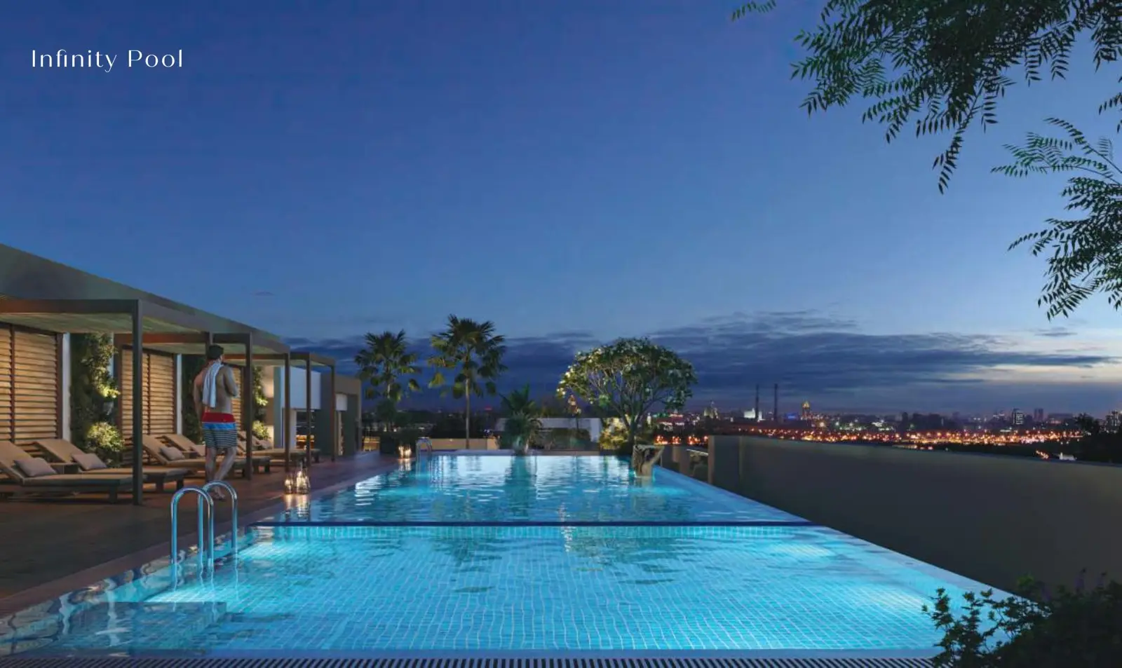 Rooftop infinity pool at night with cabanas