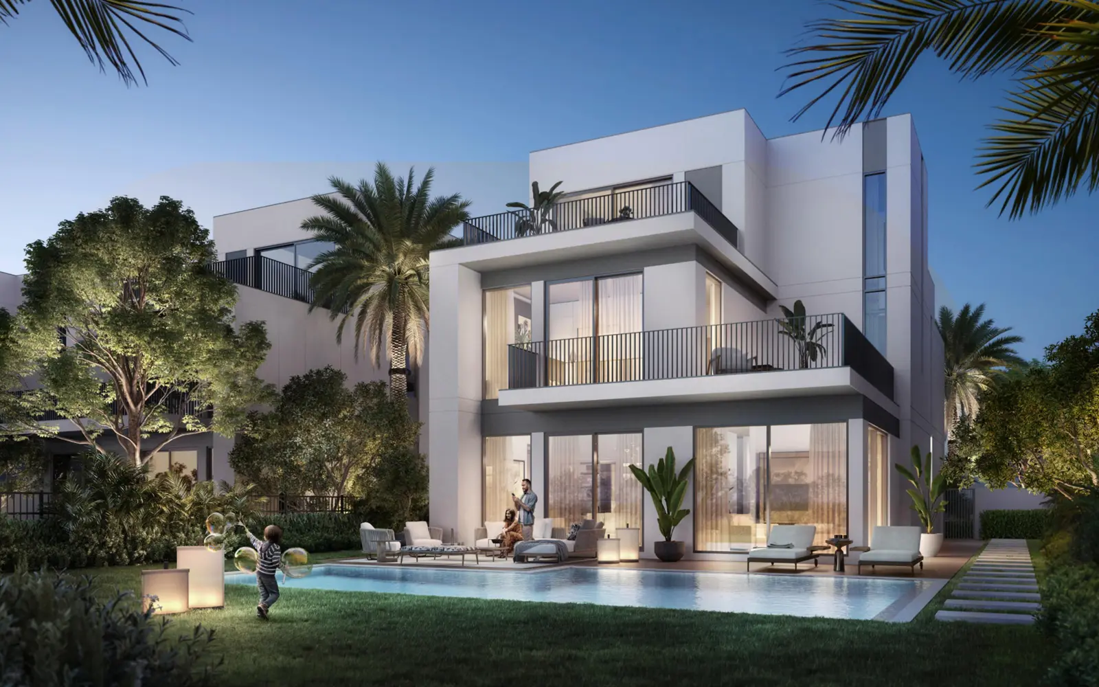 Three-storey villa with pool at dusk