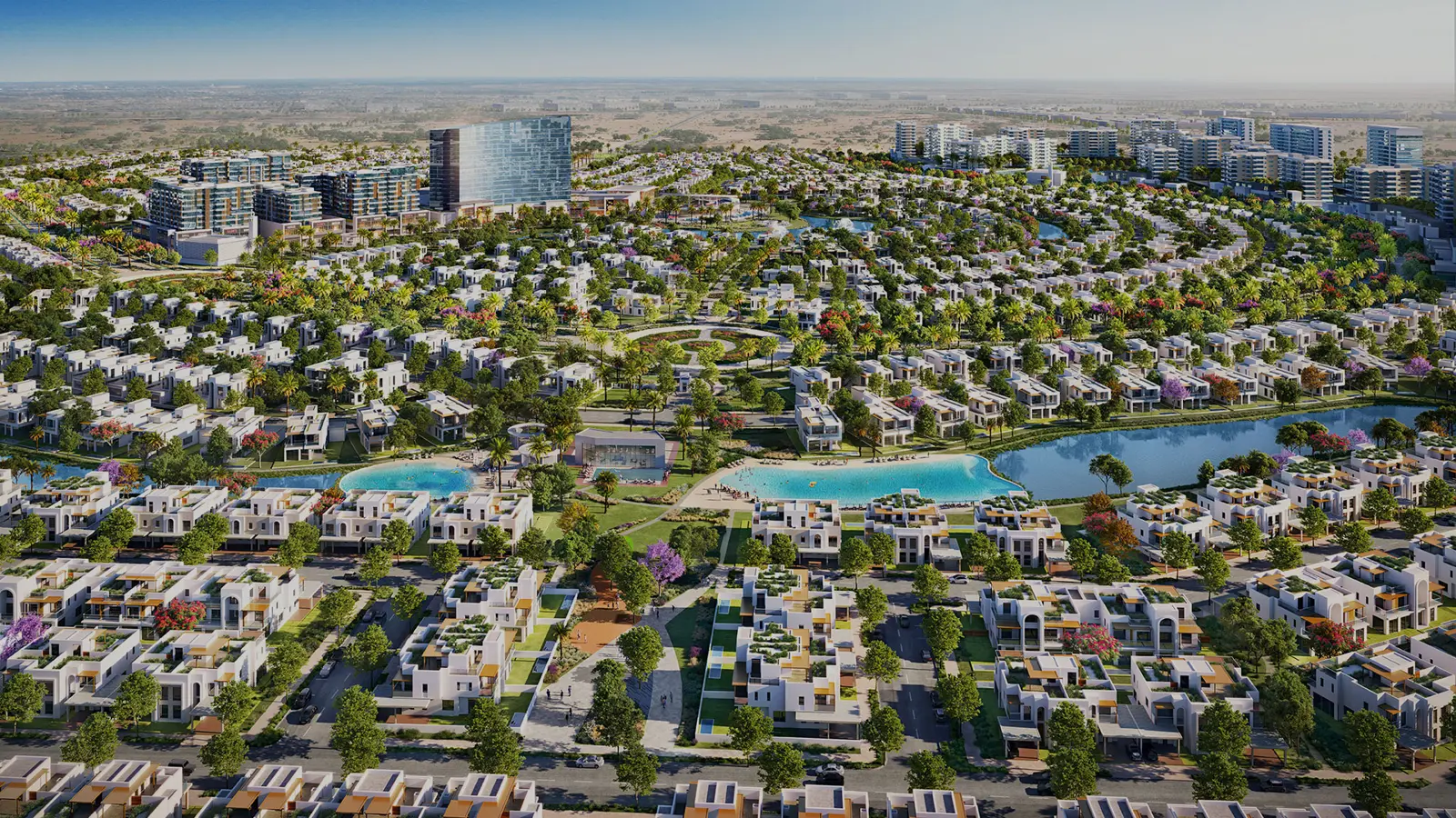Aerial view of townhouses, pools and central tower