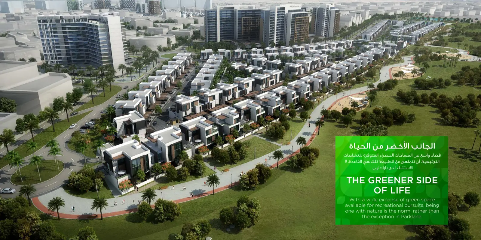 Aerial view of townhouses and towers beside a park