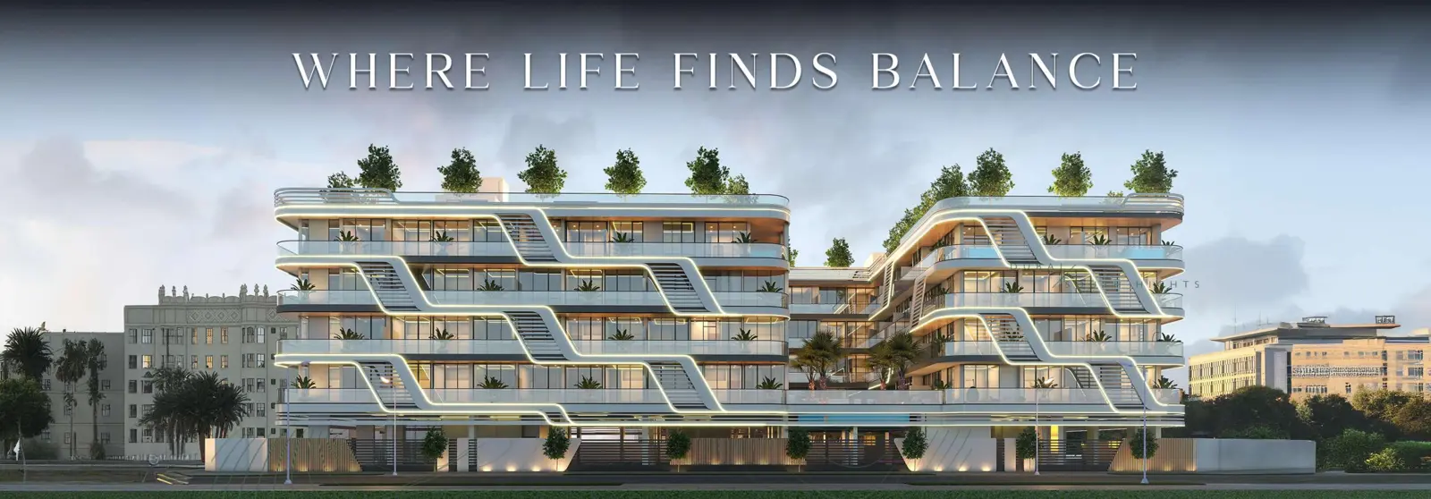 Facade with white curved bands and rooftop trees
