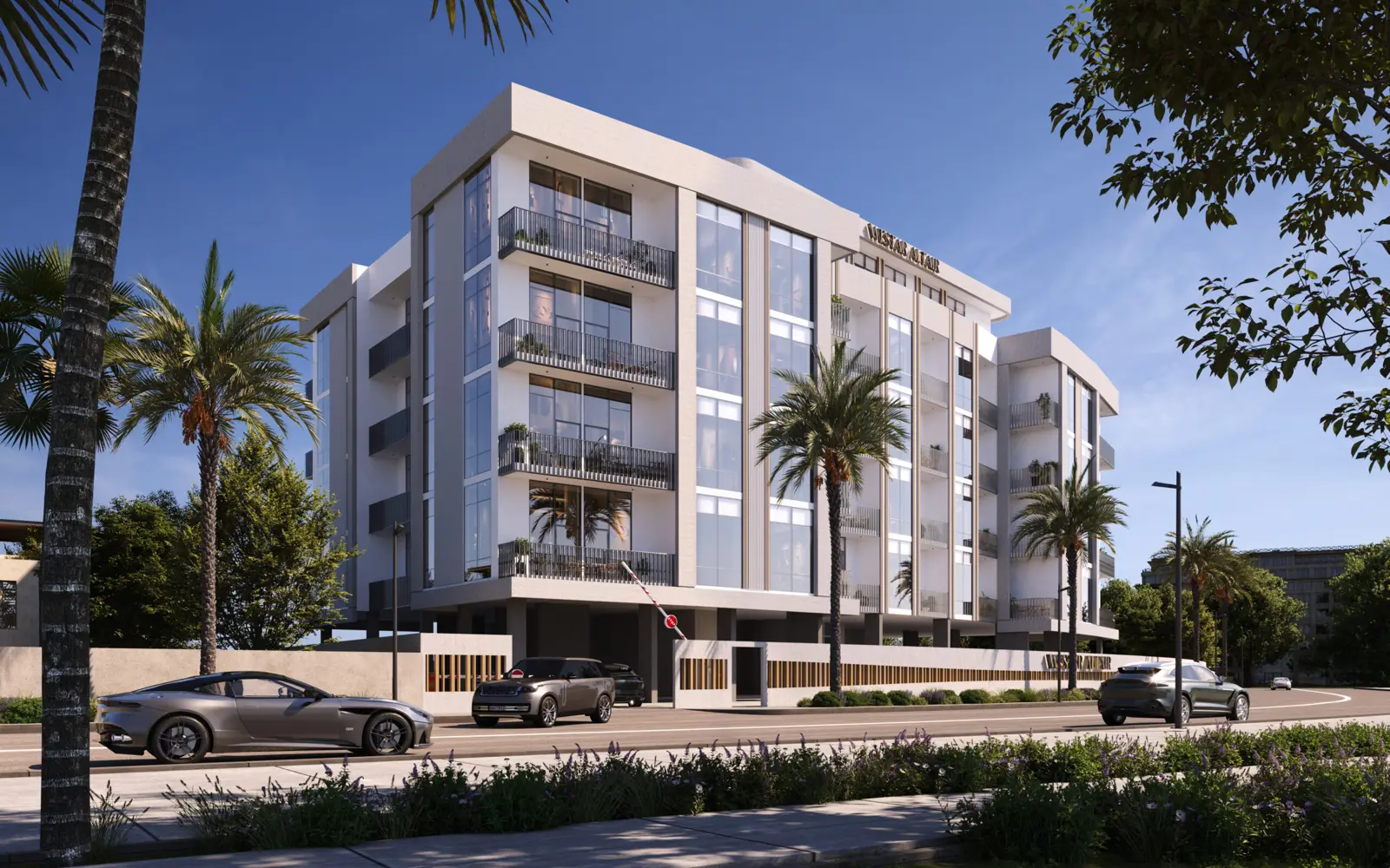 Corner view of the building with palms and street