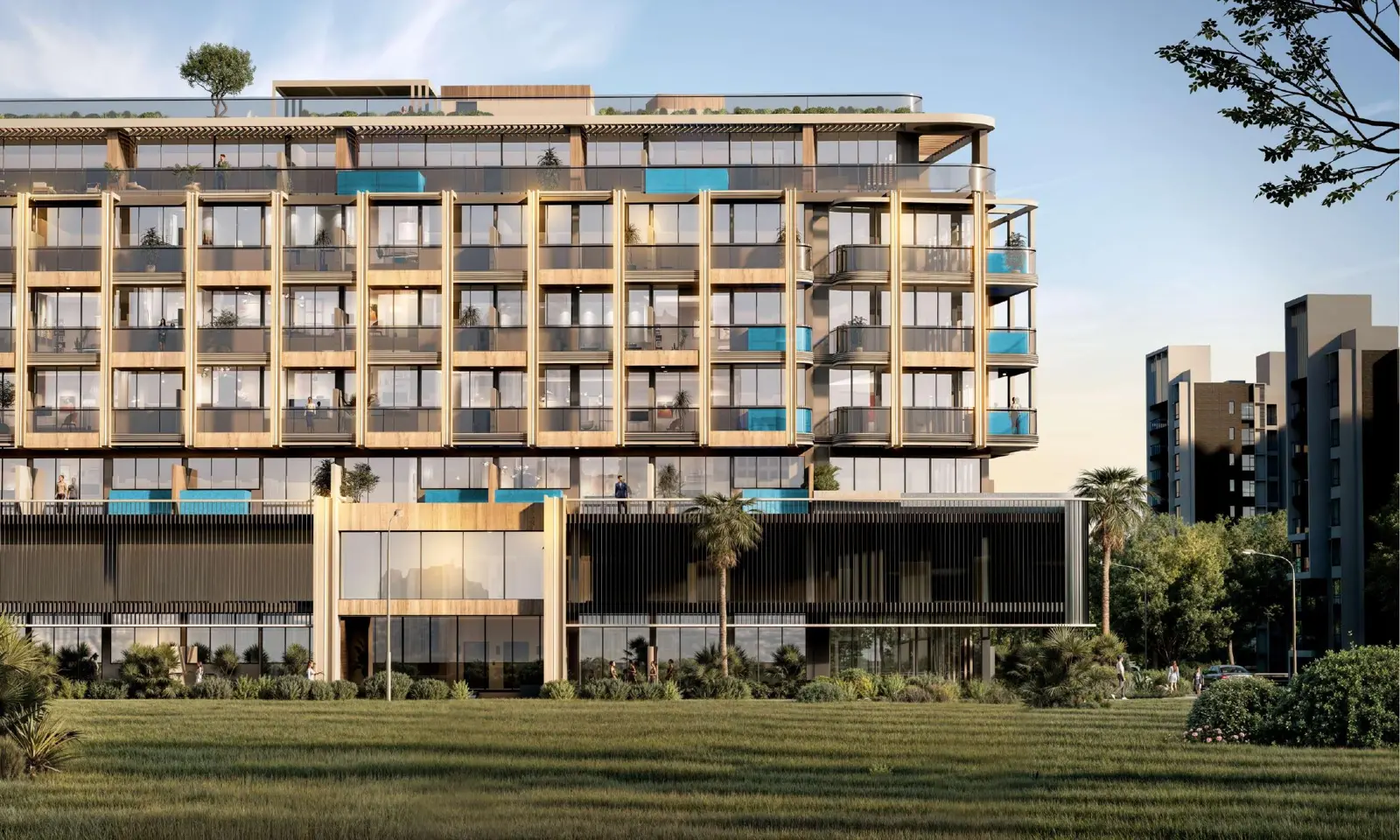 Facade seen across a lawn, with rooftop garden
