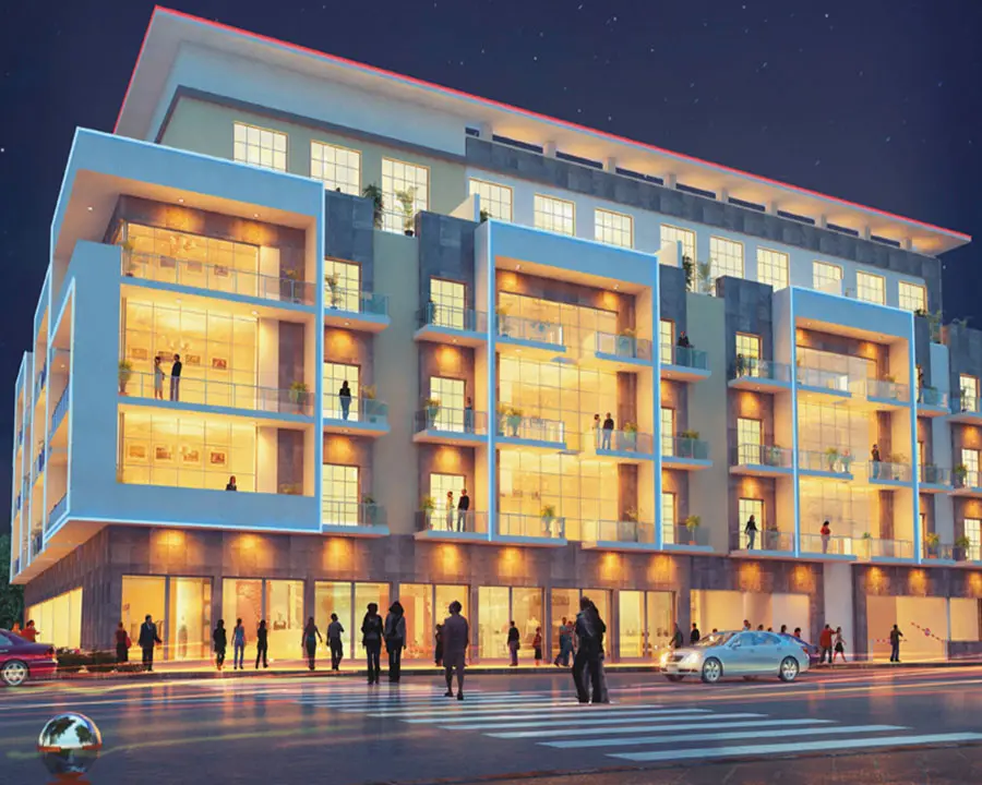 Night view of the mid-rise block with lit balconies