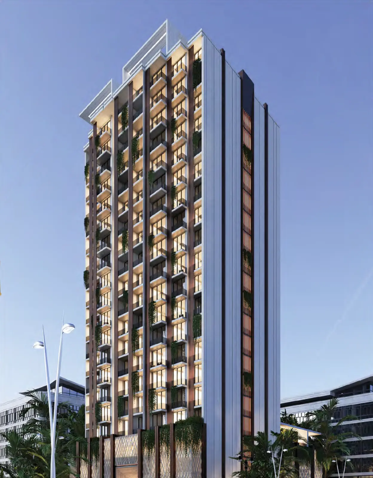 Tower facade at dusk with balconies and planting