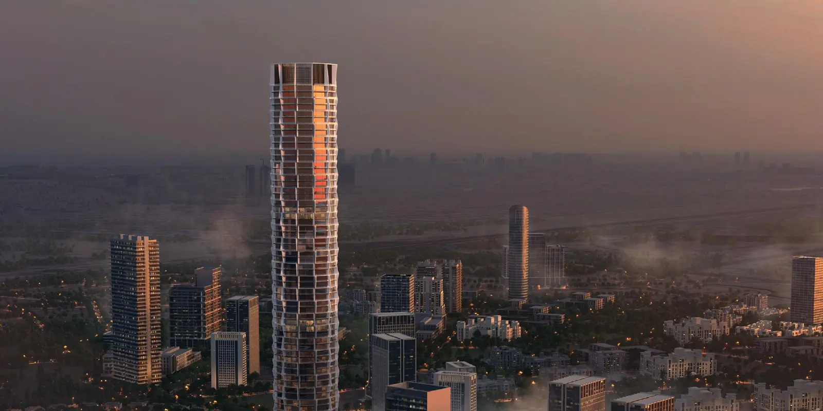 Tower rising above the JVC skyline at sunset