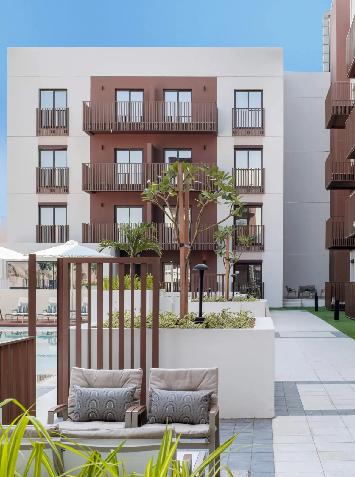 Courtyard seating and balconied facade
