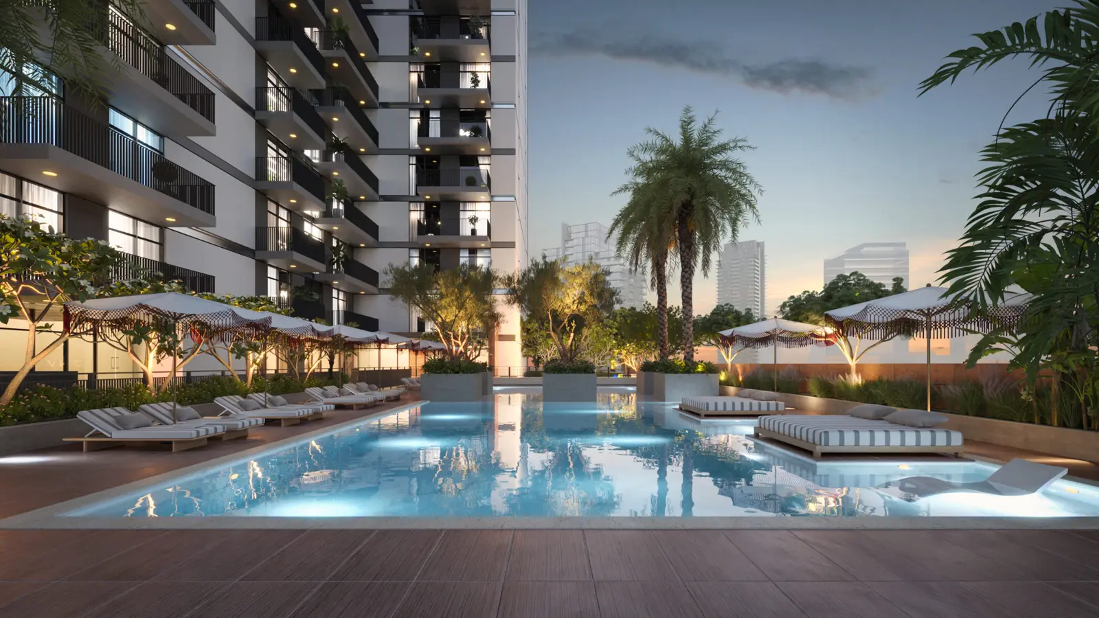 Pool deck with loungers and umbrellas at dusk