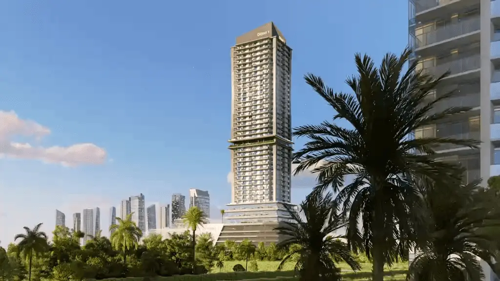 Tall slim tower seen between palm trees