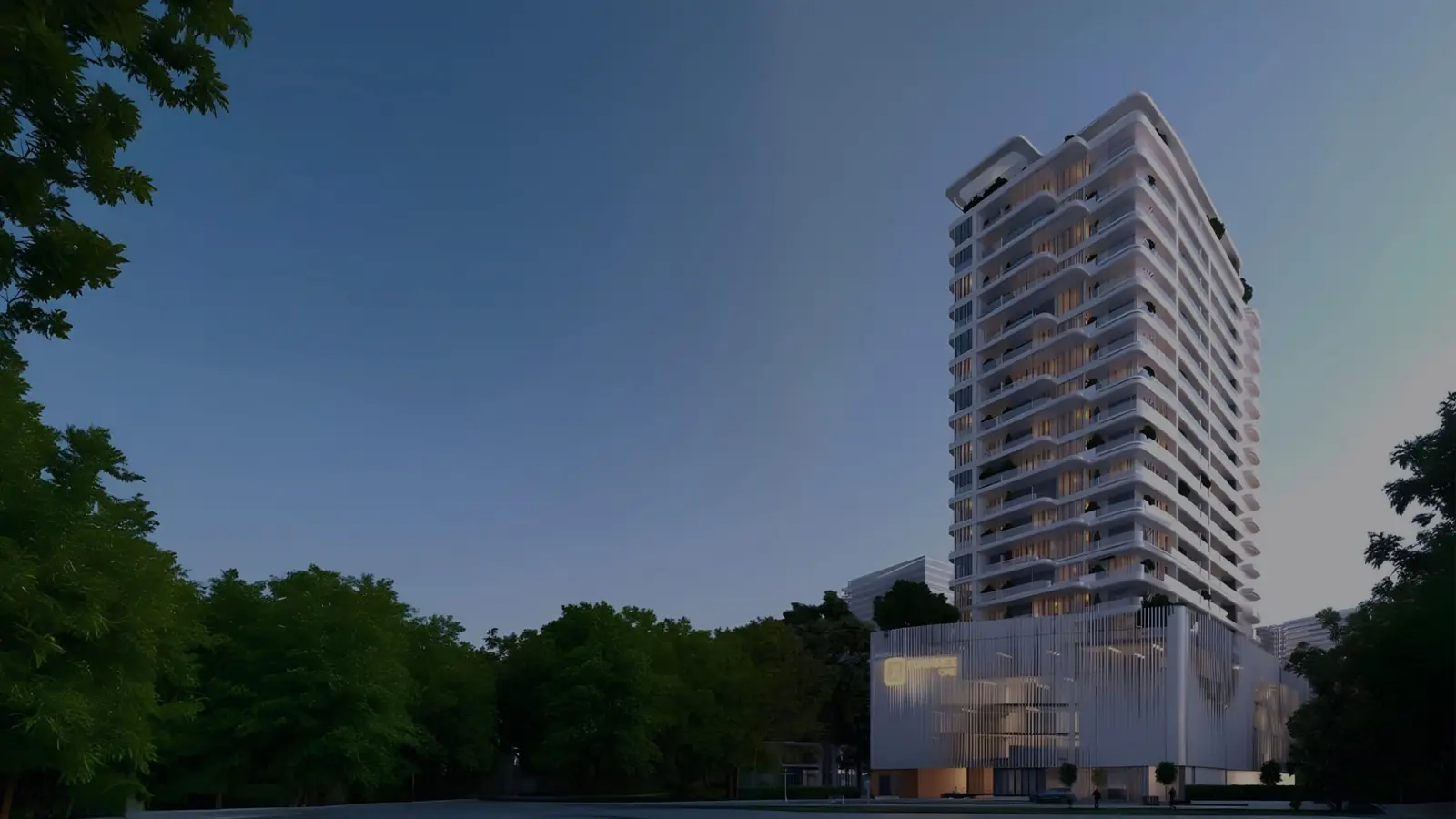 Tower and fin-clad podium at dusk among trees