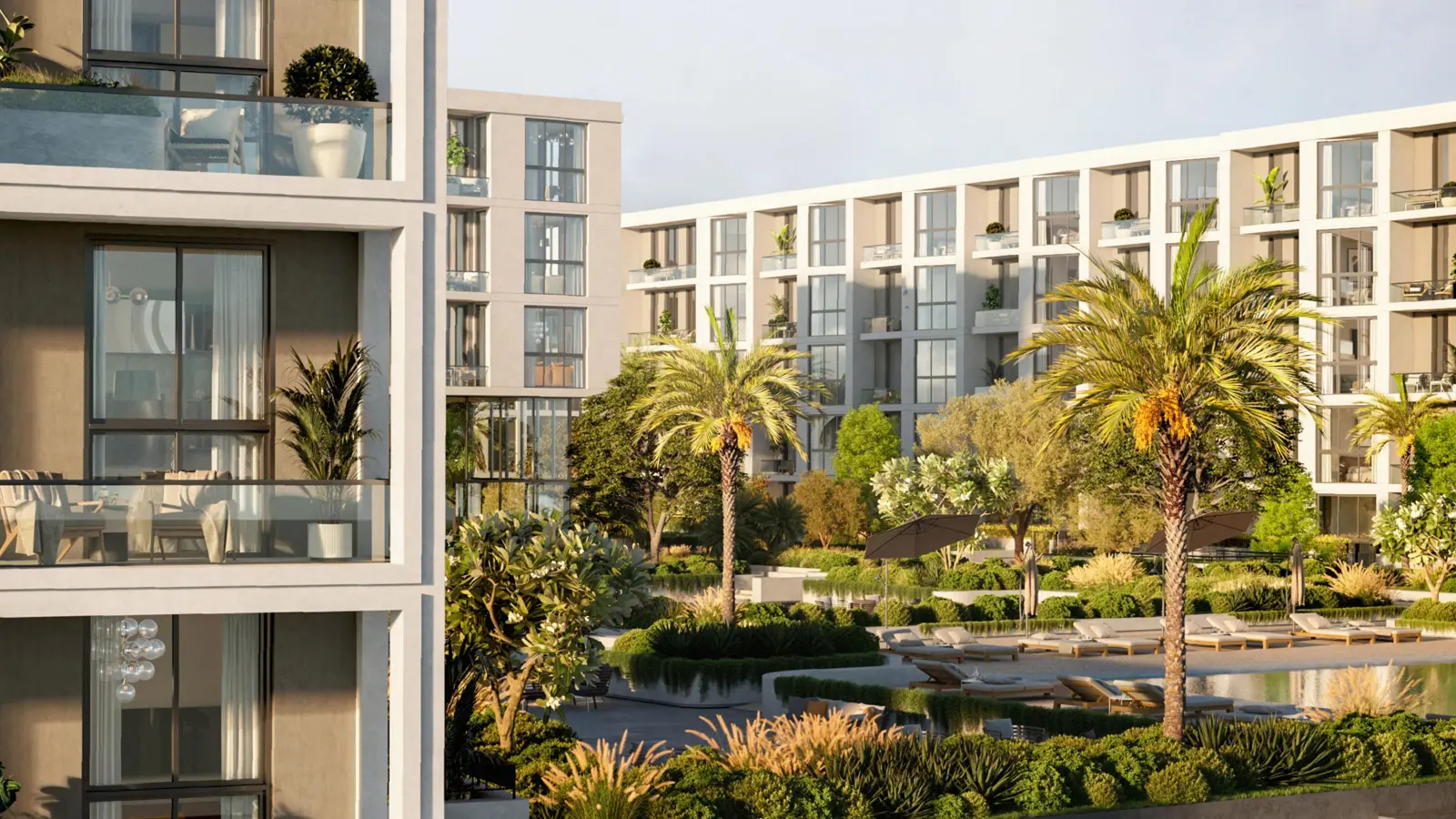 Apartment facades above the pool and sun loungers