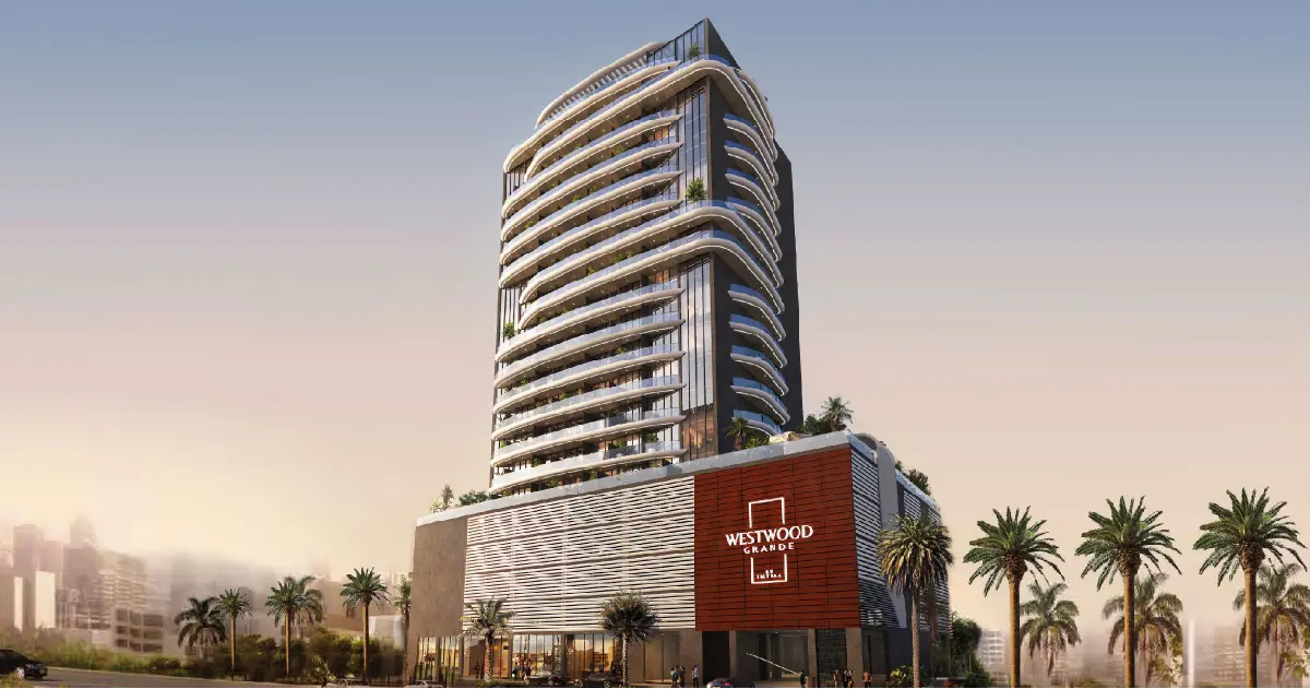 Curved balcony tower above a podium with the project sign
