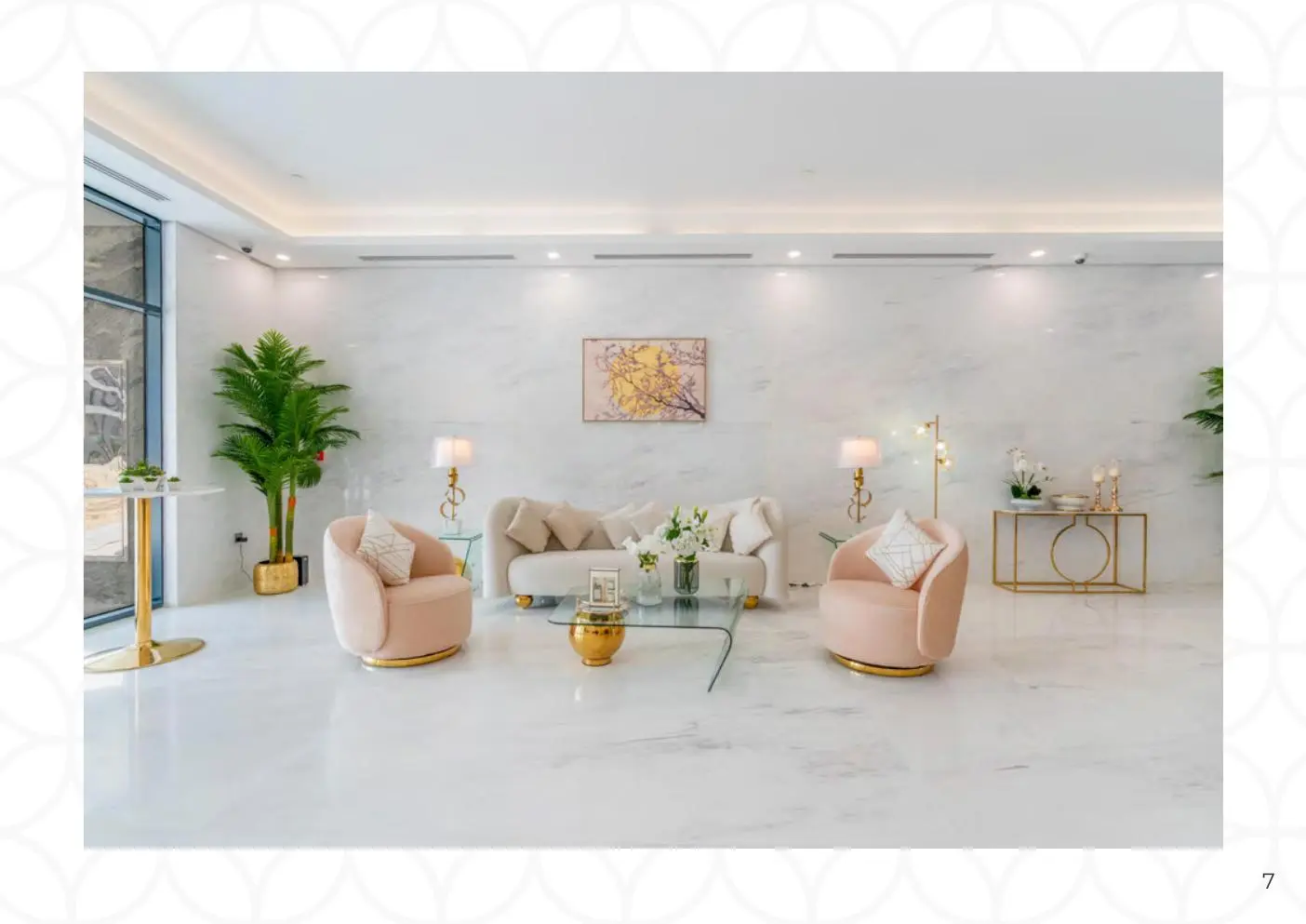 Marble lobby with sofa and pink armchairs