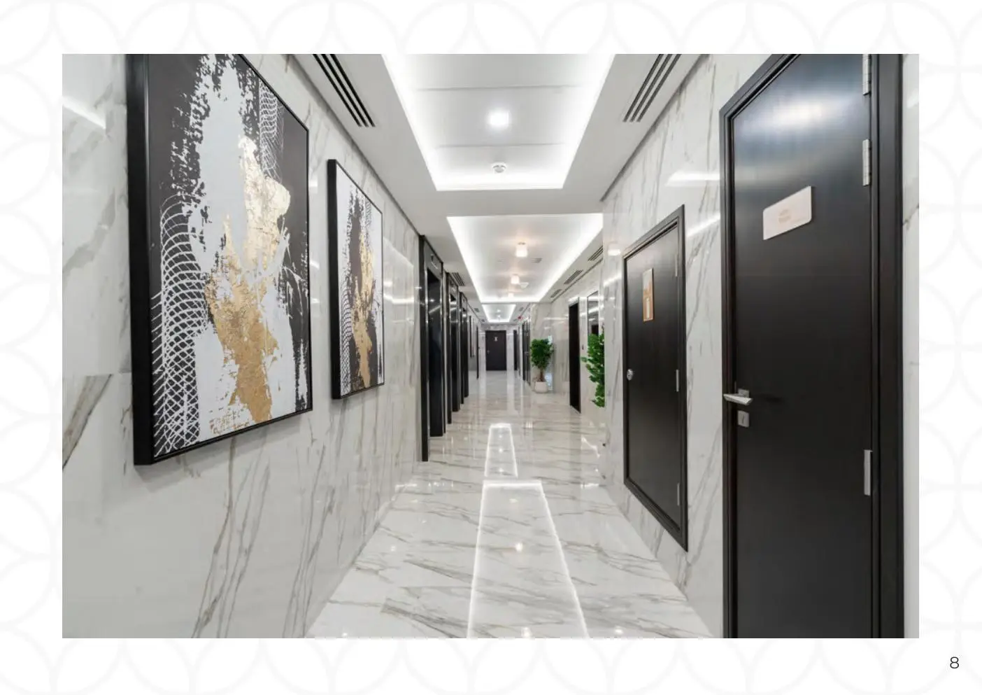 Marble corridor with artworks and dark doors