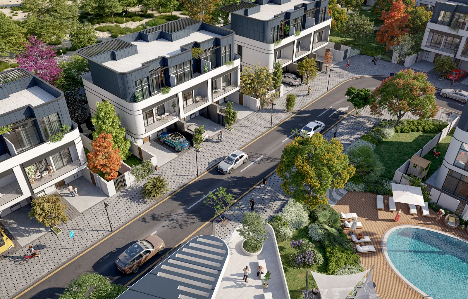 Aerial view of townhouses, street and pool