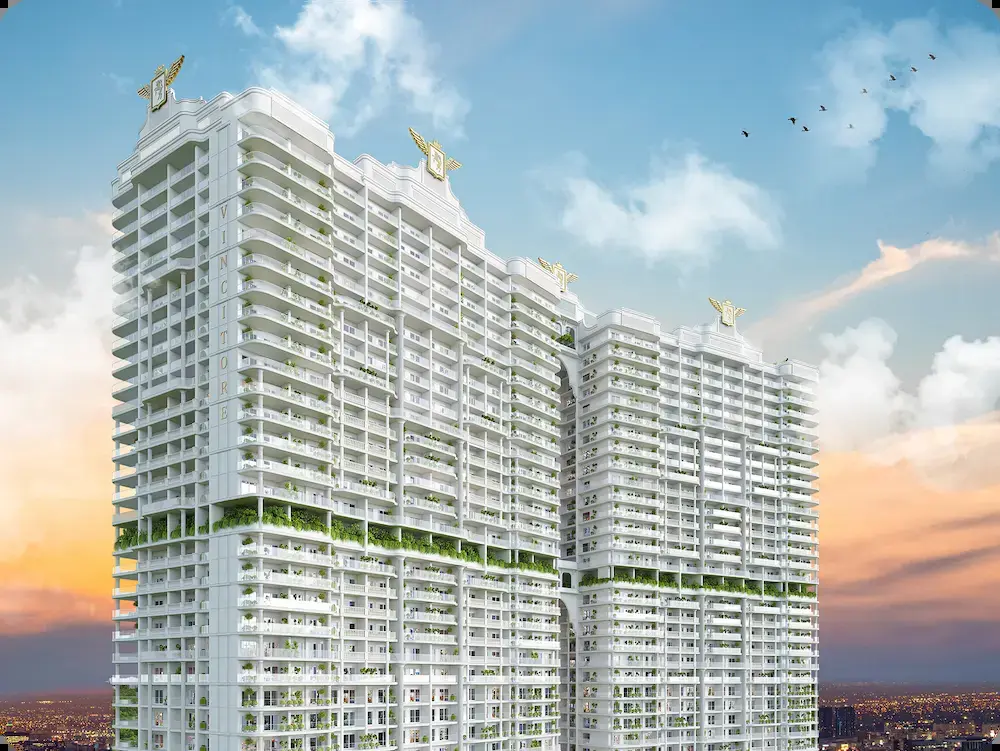 White towers at sunset with green terraces